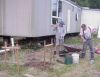 David and Matthew mixing cement for home-made pier blocks. 