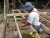 David tapping a block into position. 