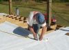 David stapling tyvek to the floor joists. 