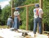 Putting the wall frame in to hold up the rafters. 