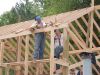 Installing the board on the ends of the rafters. 