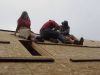 Putting the last bit of waferboard on the roof. 