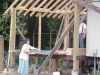 Laying out the roofing on the floor to see how it will fit on the roof. 