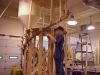 Clamping up the walnut spiral rail on a bending jig. 