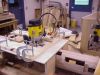 Router and jig to cut riser holes true in the spiral center column. 