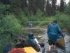 Pushing canoes up a shallow creek. What a blast. 