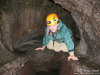 Suzanne crawling through the tree mold. 