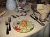 Nice salad with dessert in the background. We had a full course meal...salad, sherbert, rolls, steak, potatoes, veggies, and dessert. 