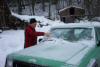 Dad's trying to scrape some of the ice off the Jeep. He has to take Christina to work today, even though school is out for him. 