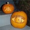 The upper pumpkin is Jeremiah's toothy-grin carving, and the lower one is Jeff's eye ball carving. 