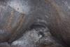A small passage from the entrance room to the big room of Scroll Canyon Cave #3. It's actually too small for a person, but we can see each other through it. 