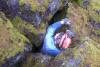 Claude climbing out of Scroll Canyon Cave #4. 